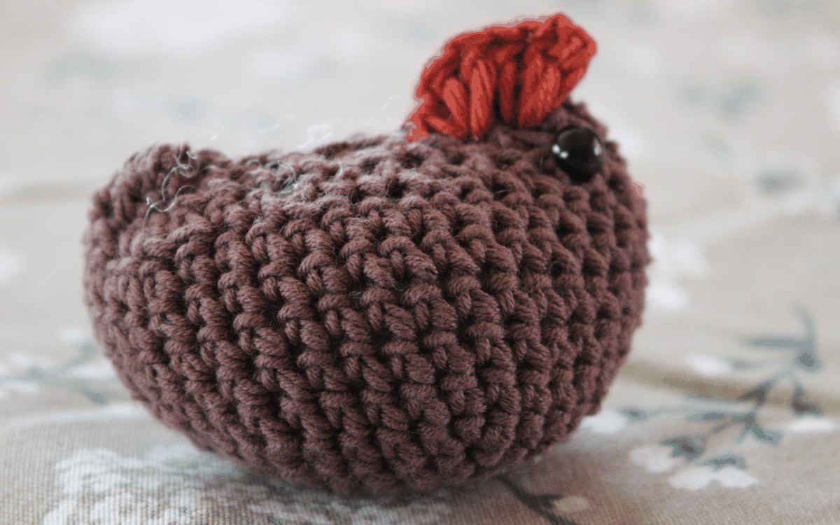 Round brown crocheted chicken