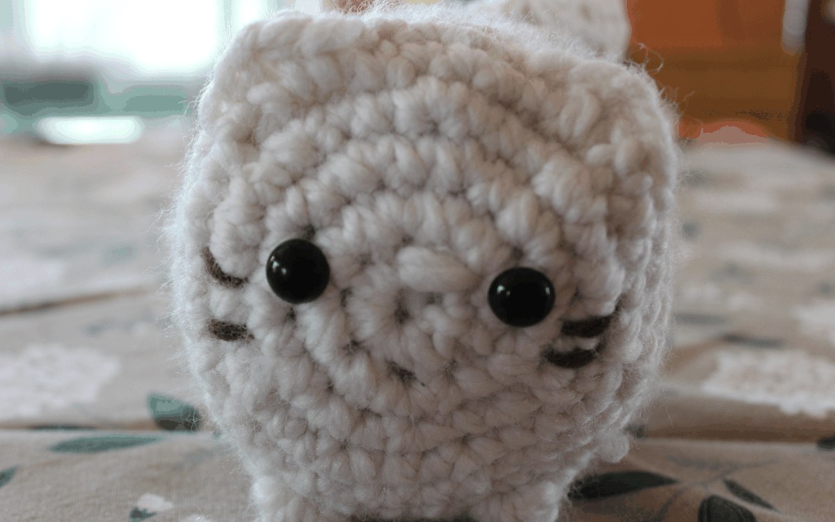 Round white crocheted marshmallow cat